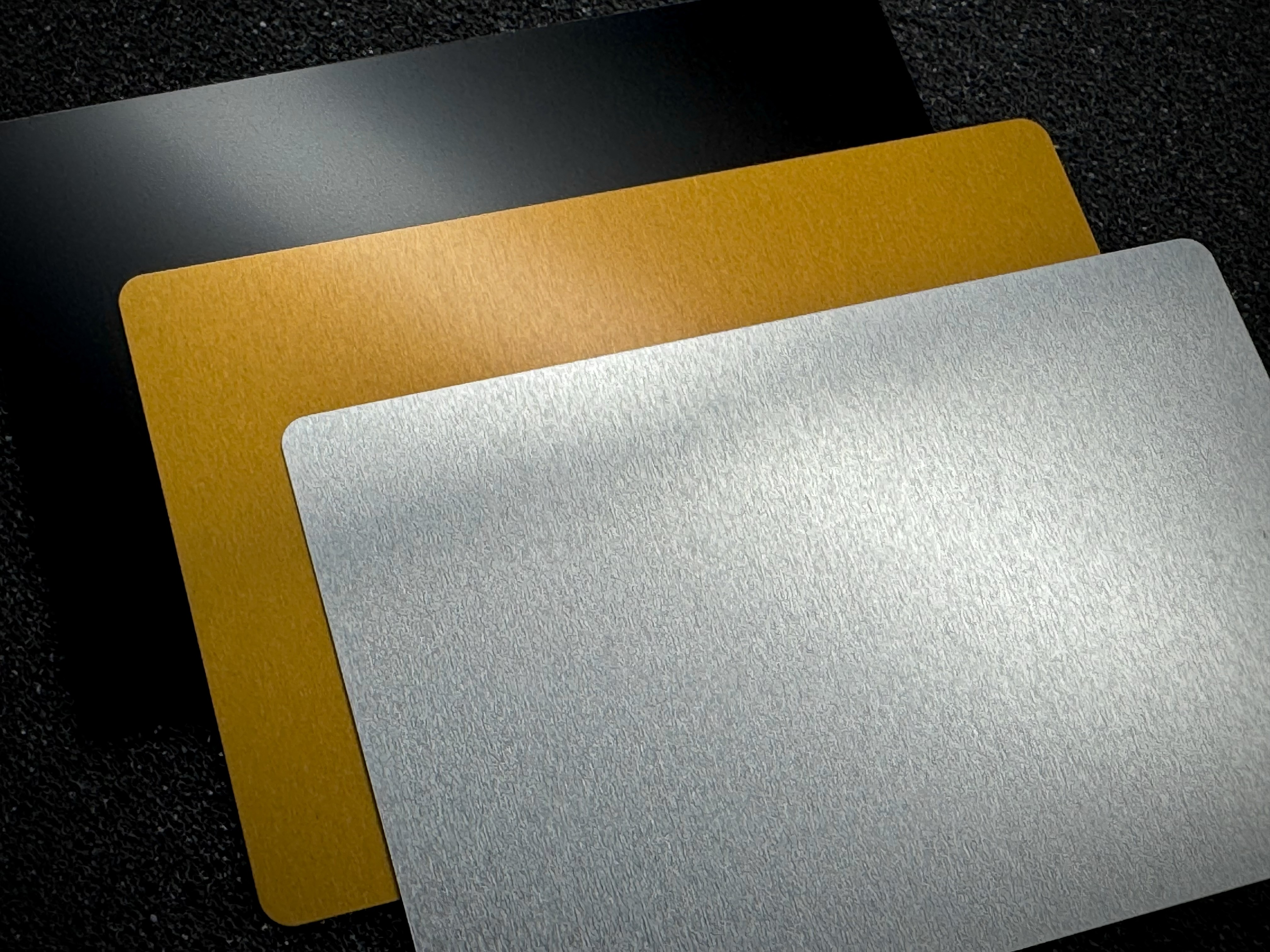 Smooth aluminum business card material.