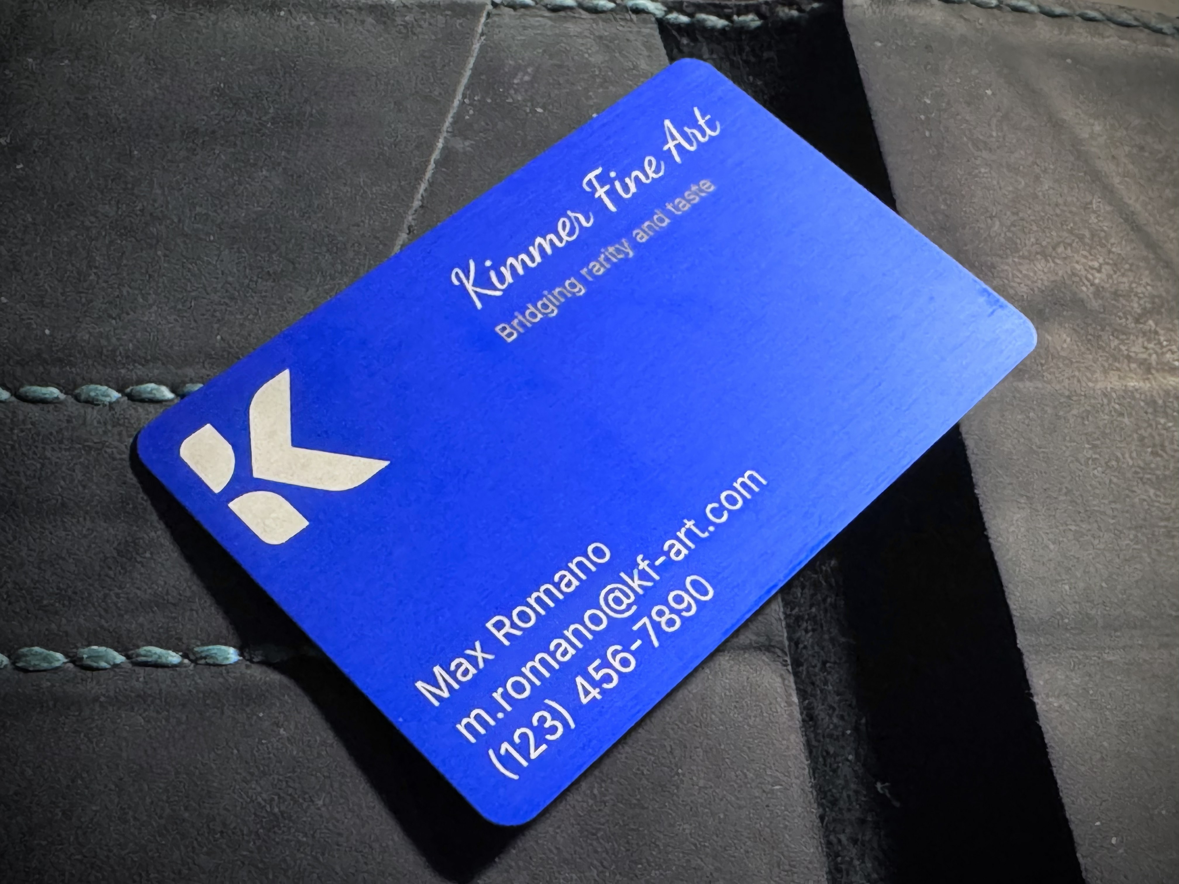 Rich, vibrant blue anodized color on brushed aluminum. Artwork and text have white laser marking.